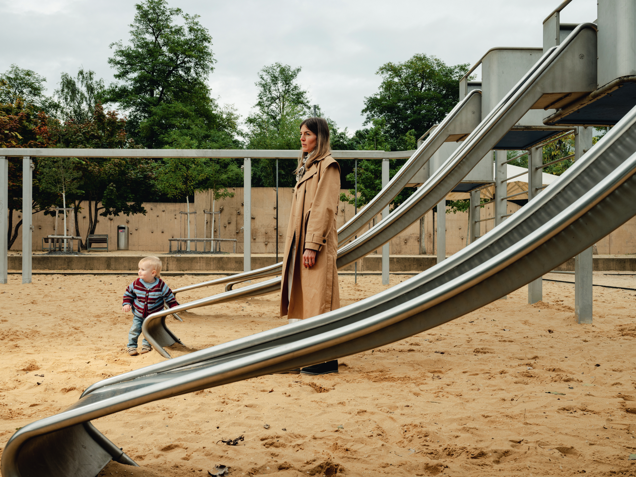 a woman with a child on the playground